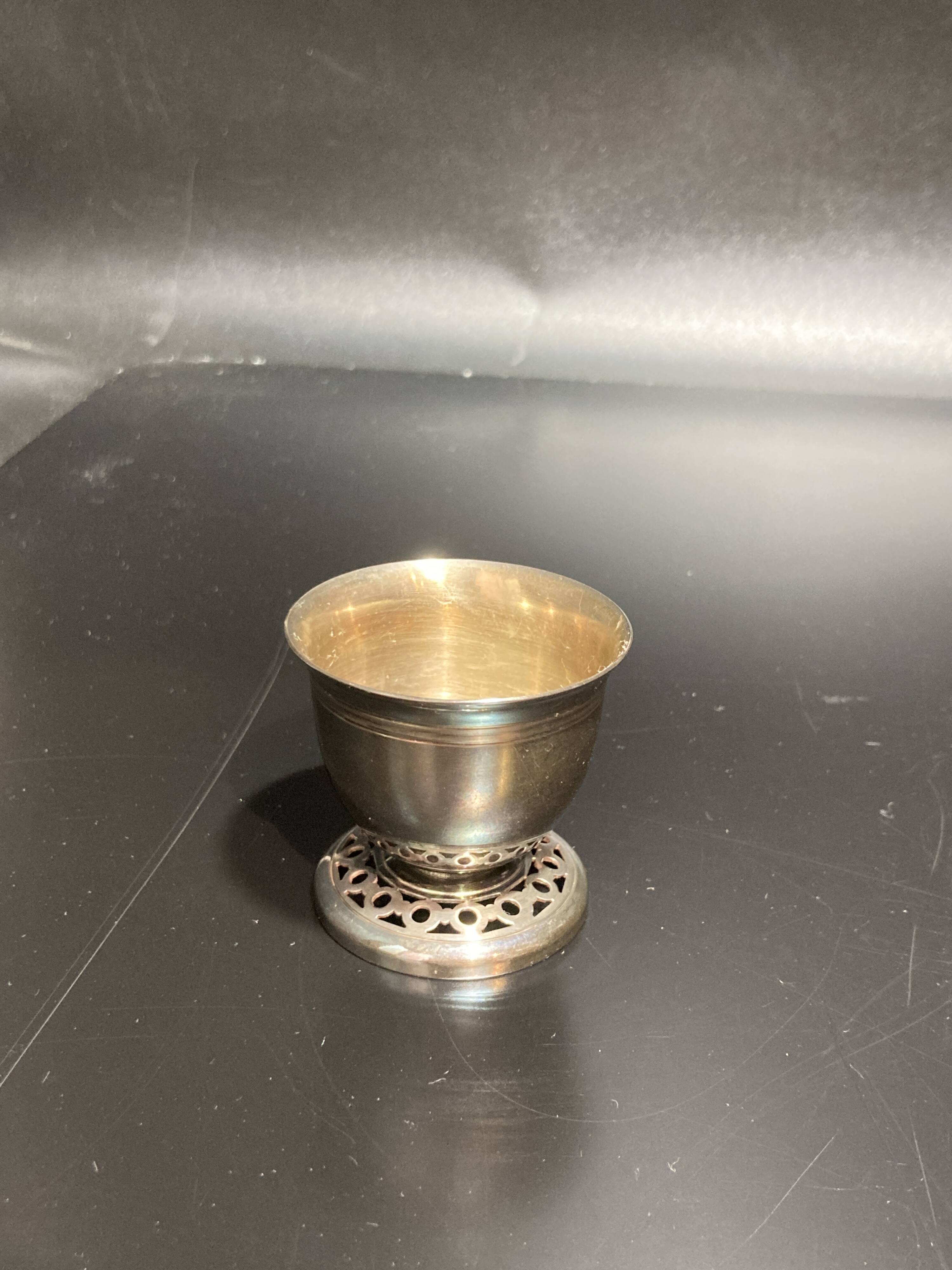 Egg cup with silver metal spoon