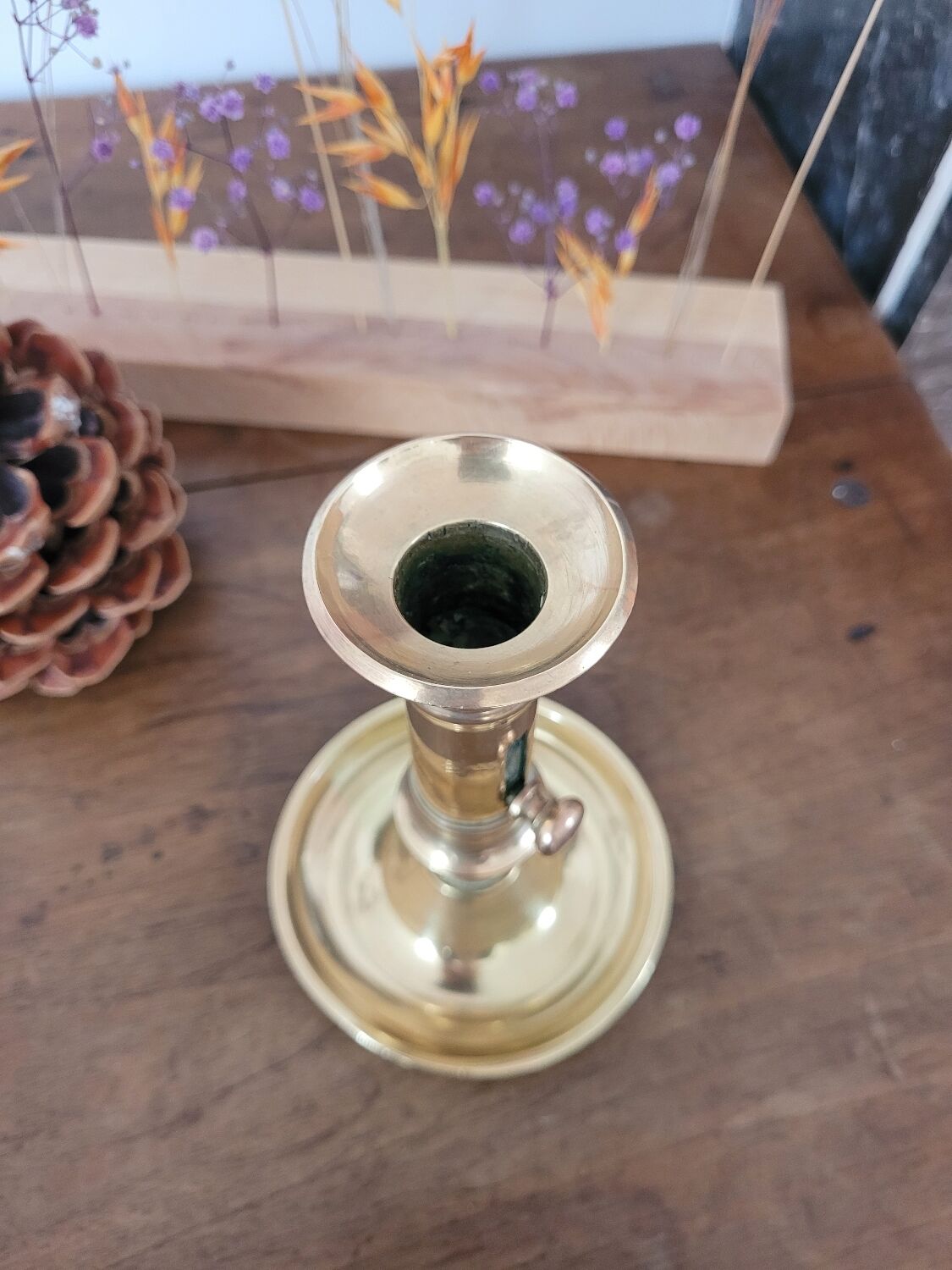 Push candle holder with hollow dish