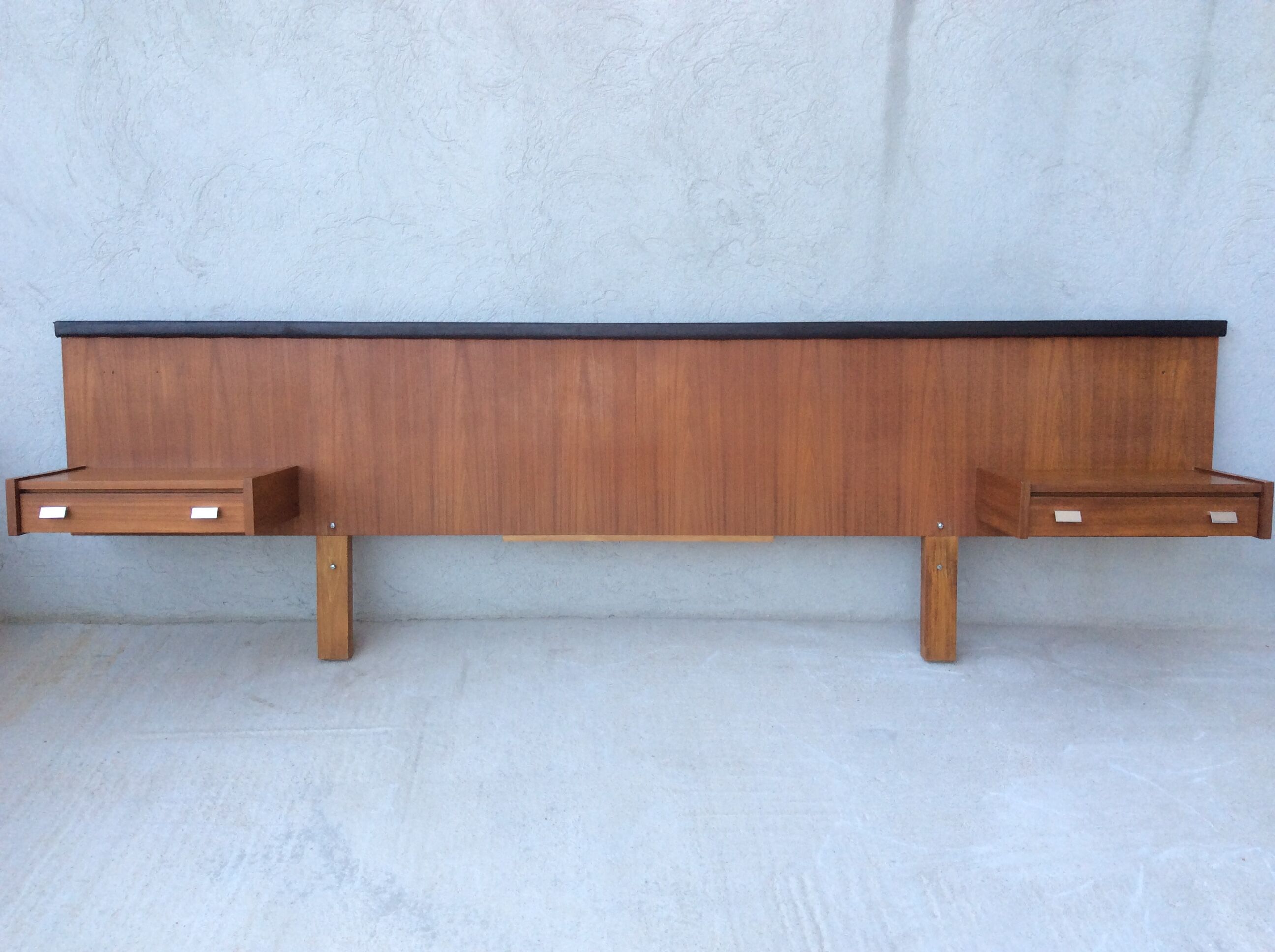 Scandinavian-style teak bed with integrated nightstands