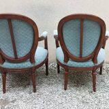 Paire de fauteuils médaillon style Louis XVI