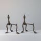 Paire de chenets en laiton au design zoomorphe vintage.