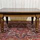 Victorian-style mahogany English table with 3 extensions.