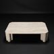 Antona travertine coffee table by the Italian publisher Up&Up.
