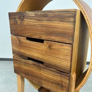 Oval wooden commode by Kreatippcci Studio