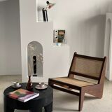 Reclined armchair in canned teak in natural wood