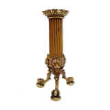 Golden candle holder with lion's head and legs