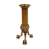 Golden candle holder with lion's head and legs