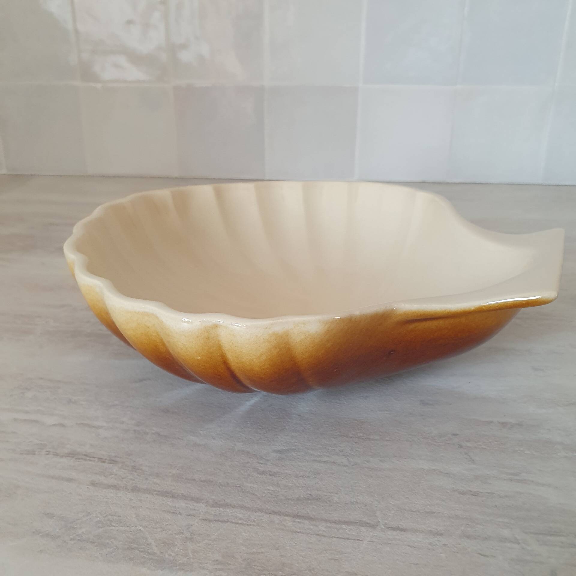 Brown and white ceramic shell bowl