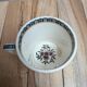 Antique ironstone cup from Sarreguemines with polychrome decoration.