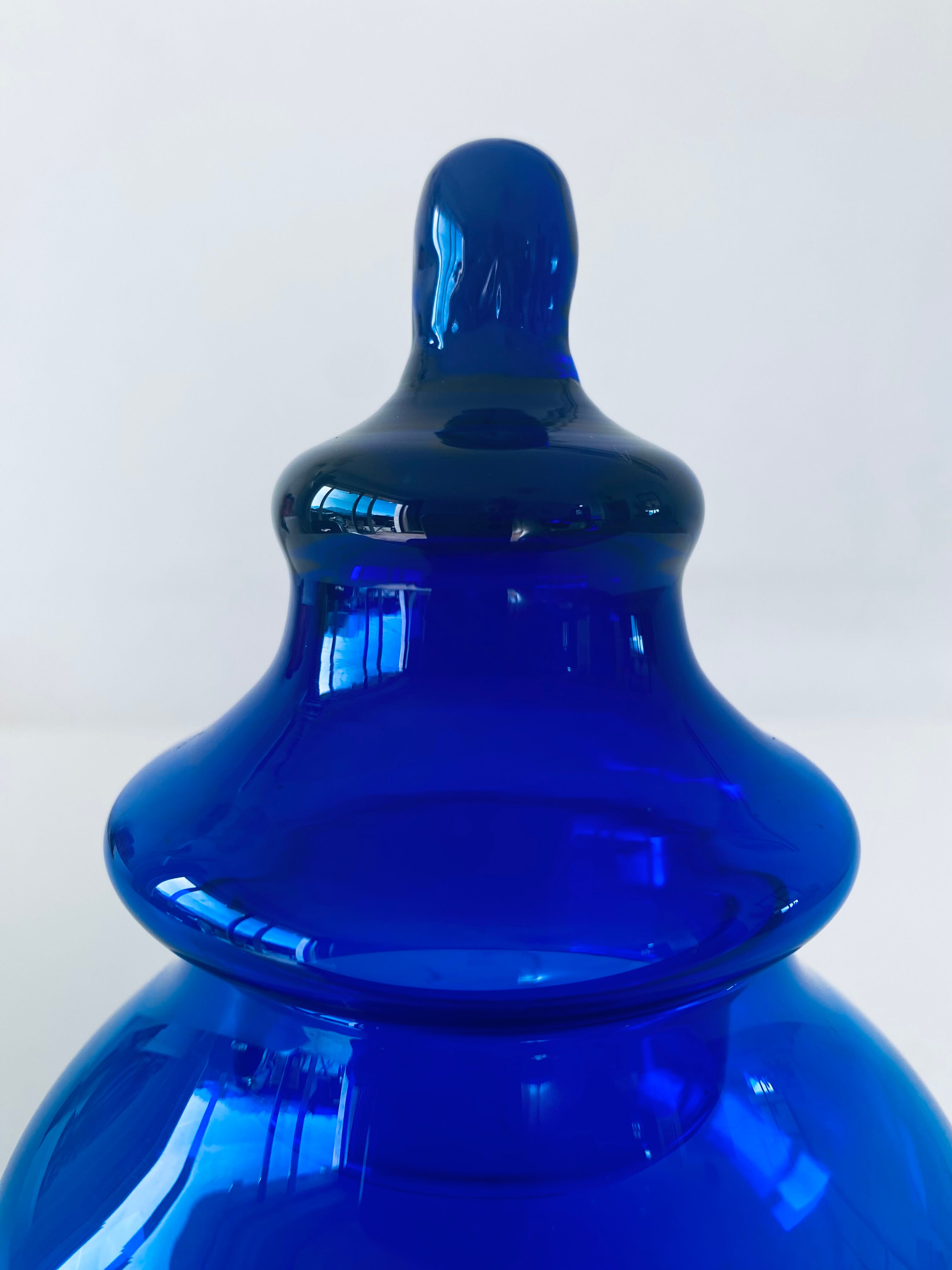Blue glass apothecary shaped bottle