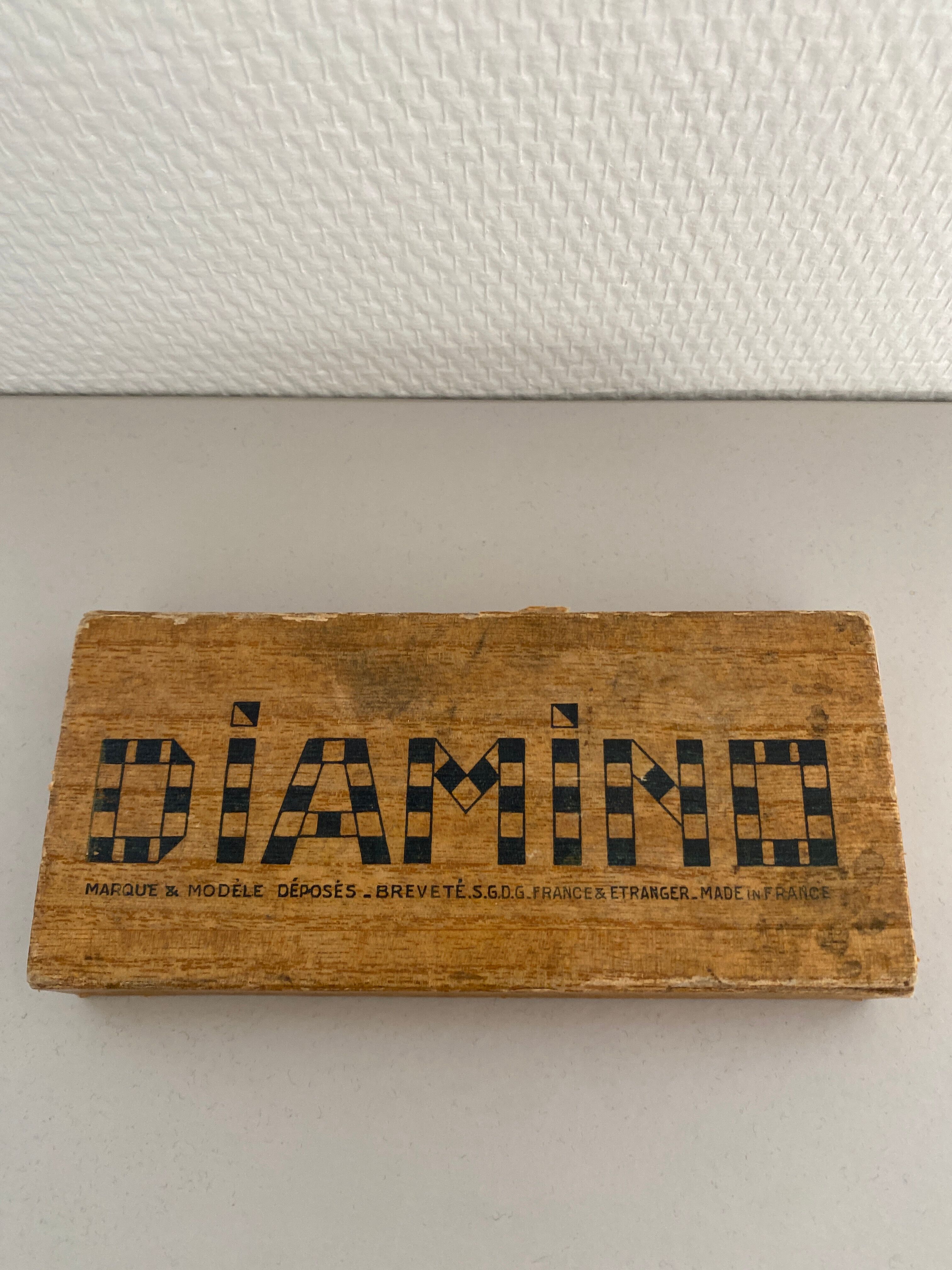 Diamino complet jeu de lettres ancêtre du scrabble