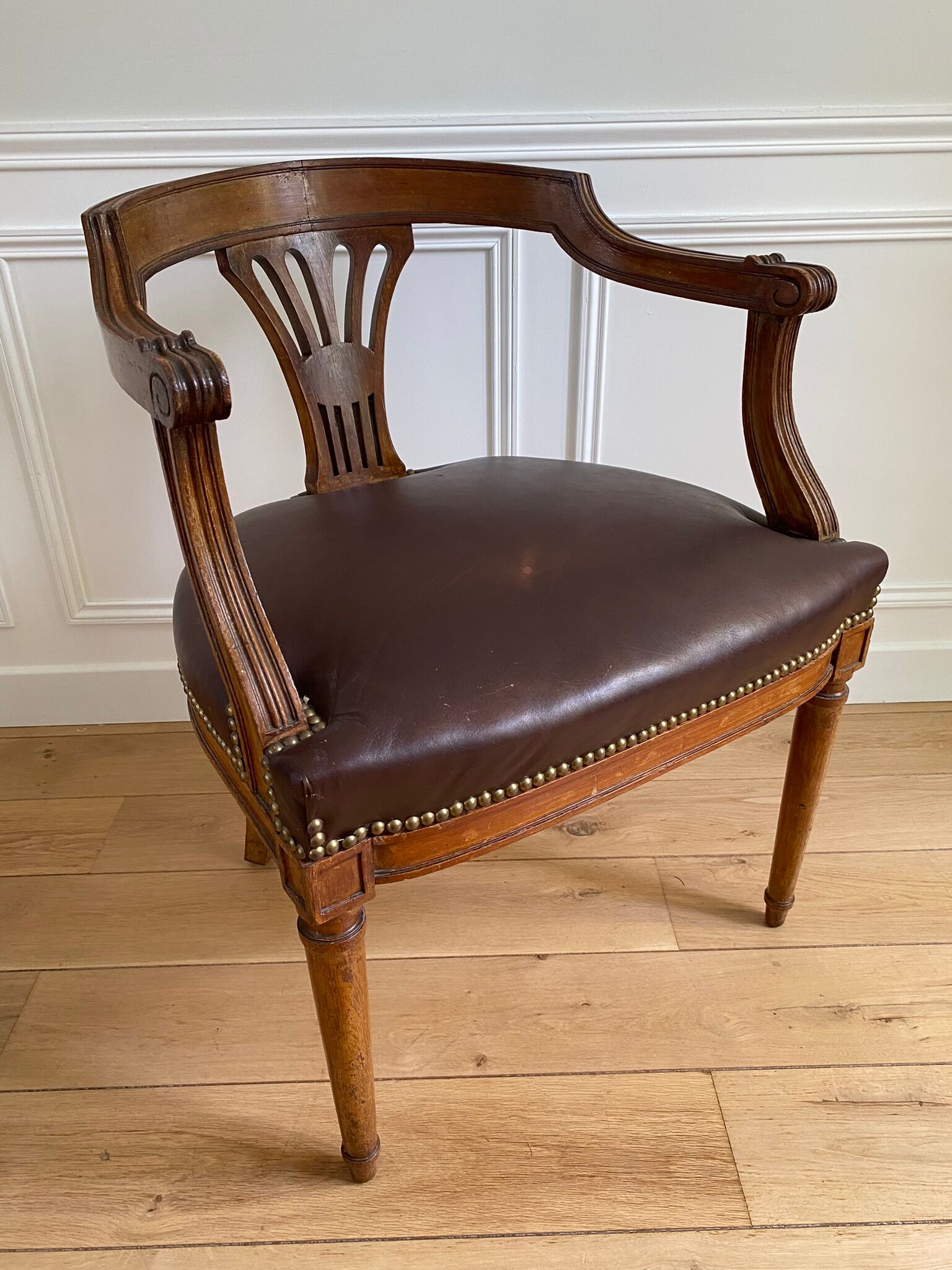 Vintage office chair in wood and brown studded leather late nineteenth