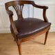 Vintage office chair in wood and brown studded leather late nineteenth