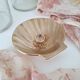 Shell-shaped brass catchall.