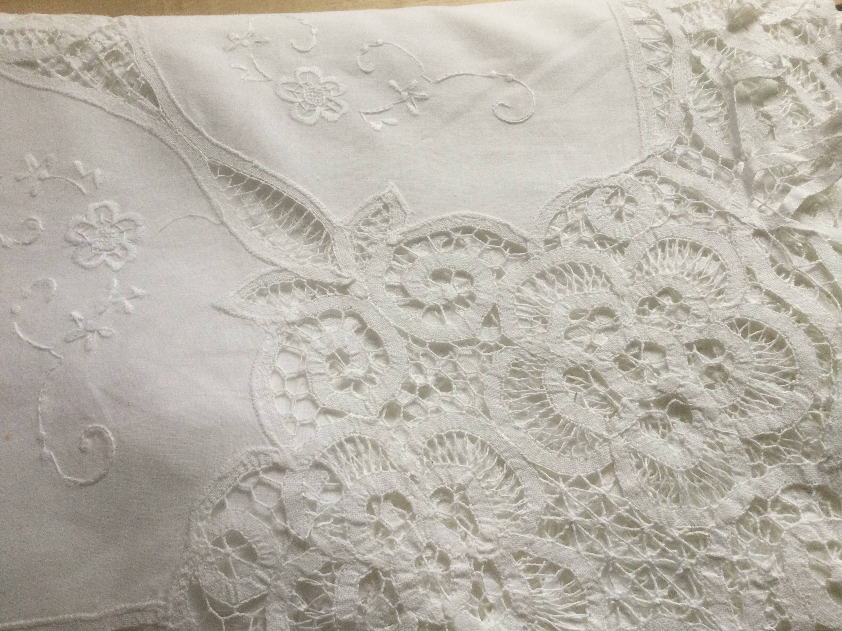 Embroidered white tablecloth and lace