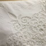 Embroidered white tablecloth and lace