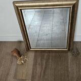 Beveled mirror under gold frame