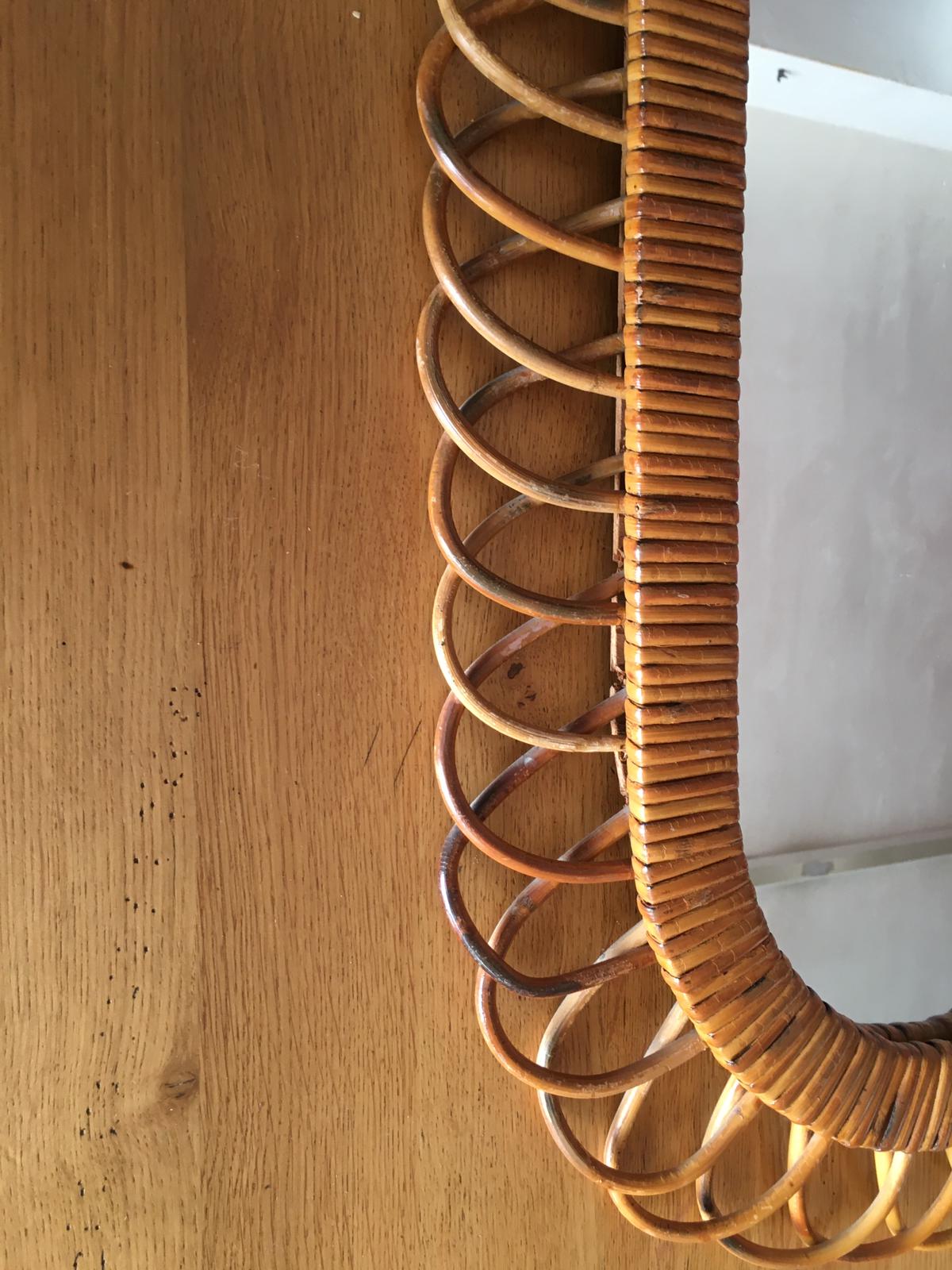 Oval mirror in vintage rattan