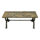 Brutalist-style coffee table made of mixed wrought iron and stone.