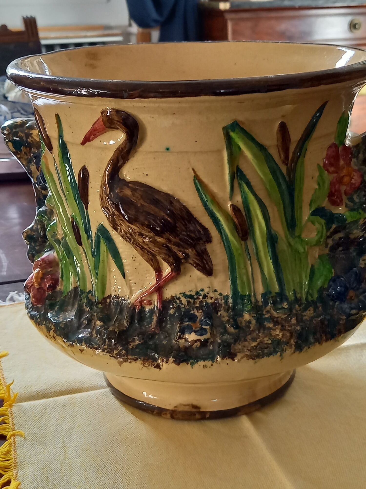 Pot cover in slip pattern birds small shine on brown border of the foot