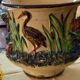 Pot cover in slip pattern birds small shine on brown border of the foot