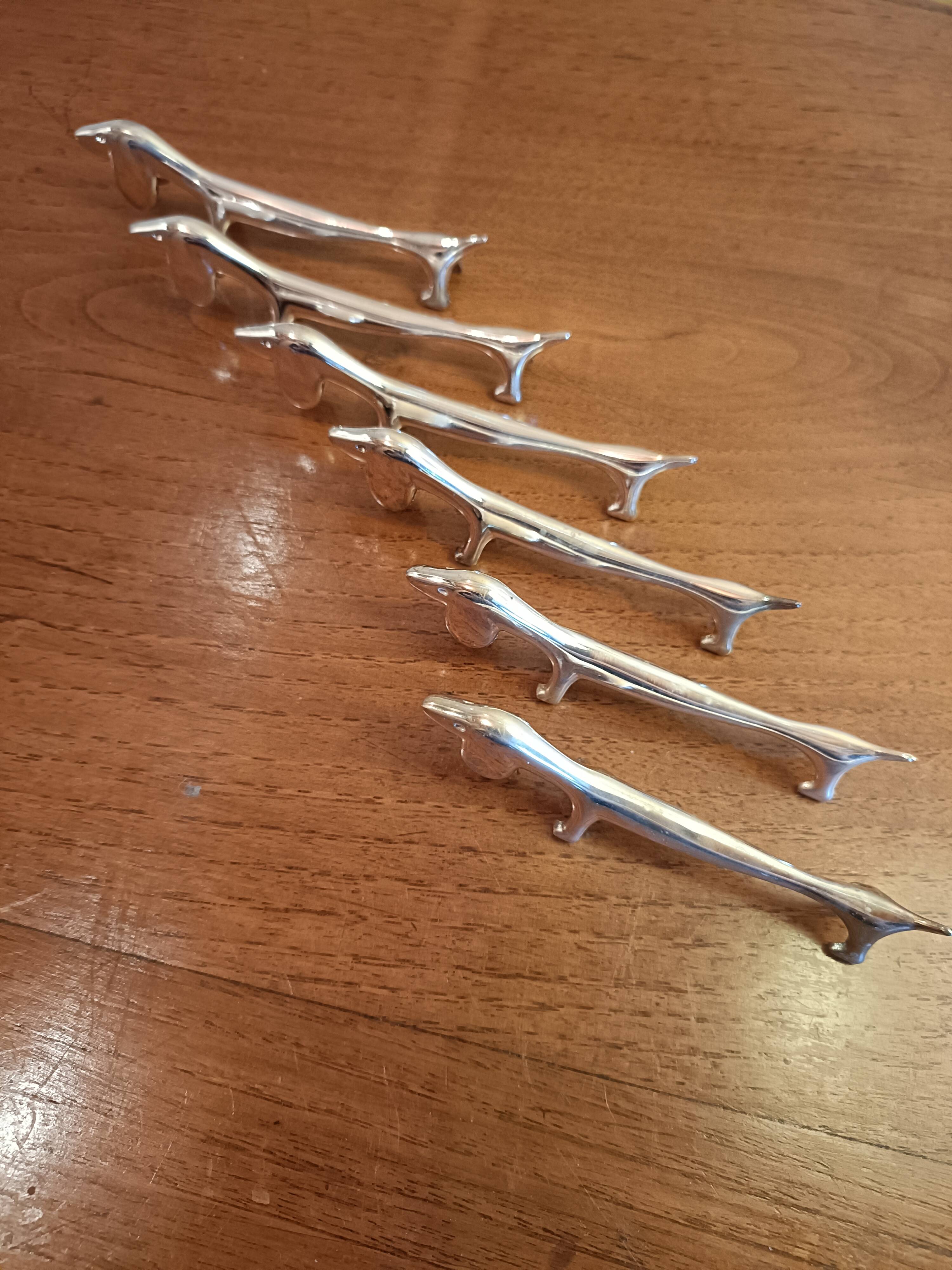 Six silver metal knife holders basset hound