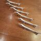 Six silver metal knife holders basset hound