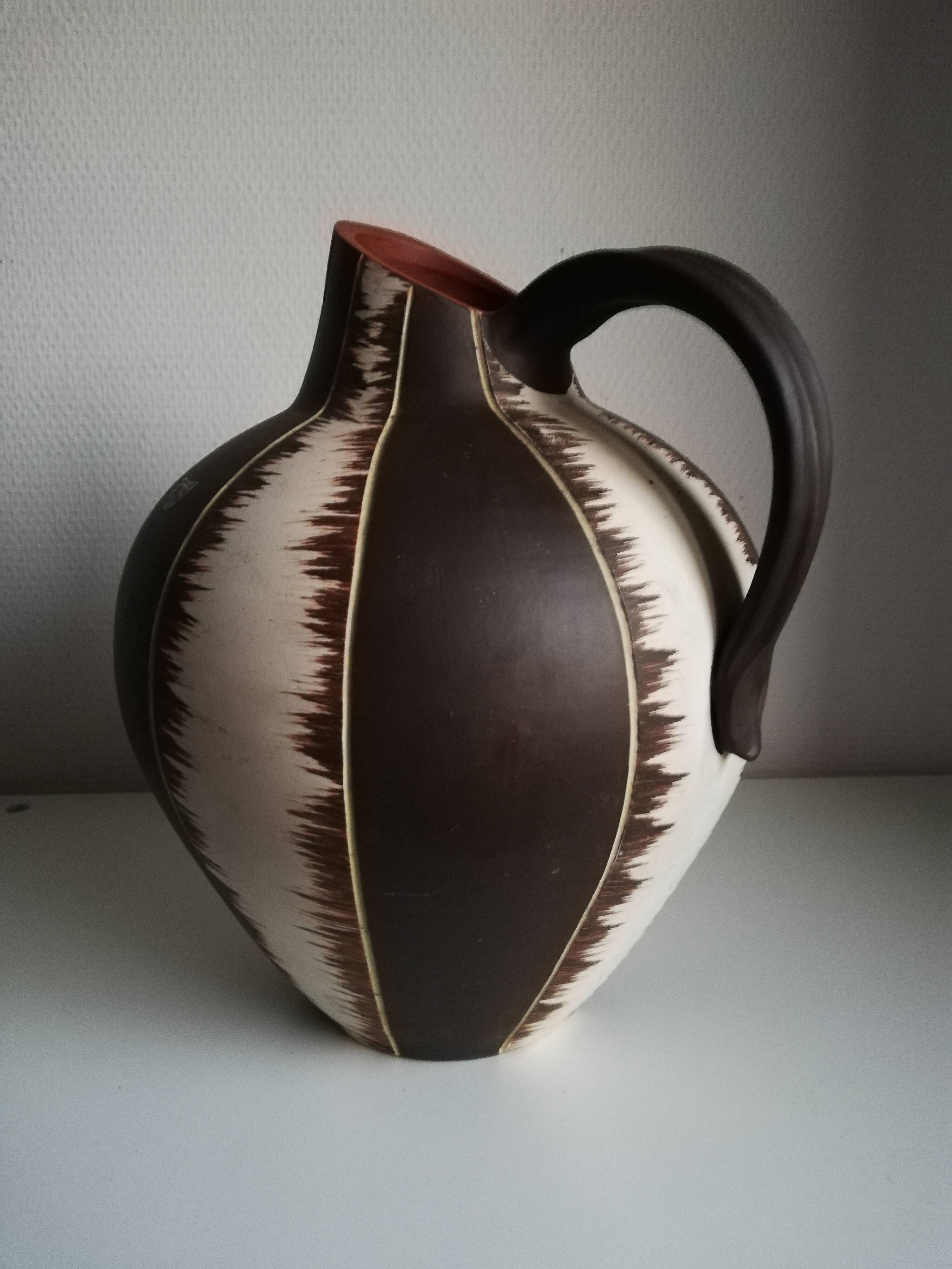 Ceramic pitcher signed
