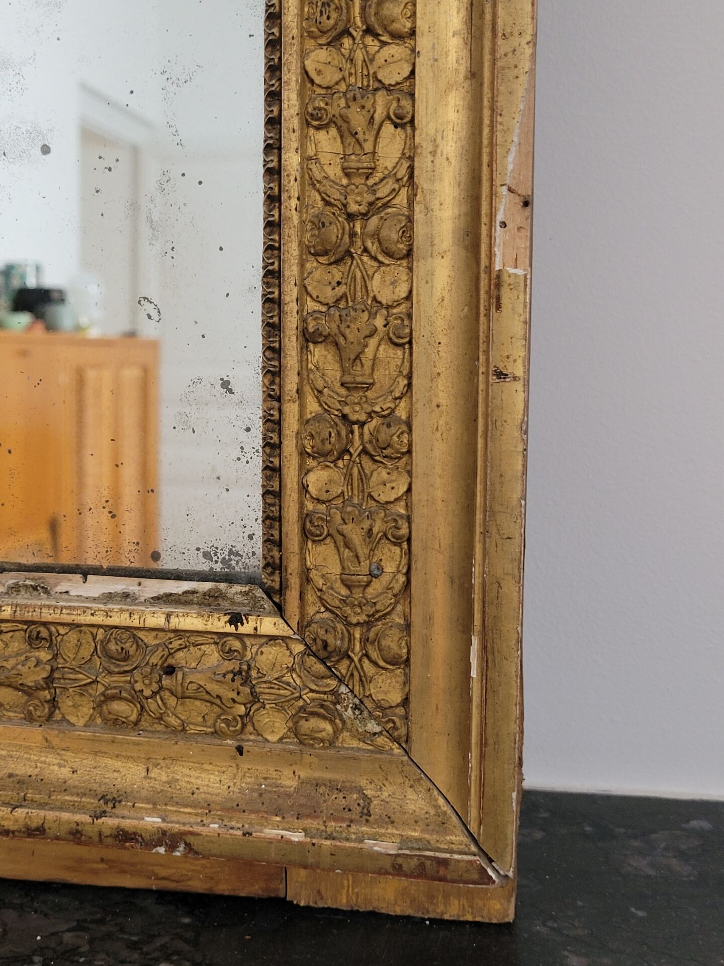Golden stucco and wood Empire mirror