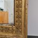 Golden stucco and wood Empire mirror