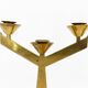 Pair of modernist three-armed solid brass candlesticks, circa 1960