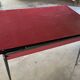 Vintage kitchen table in red formica and its 4 chairs.