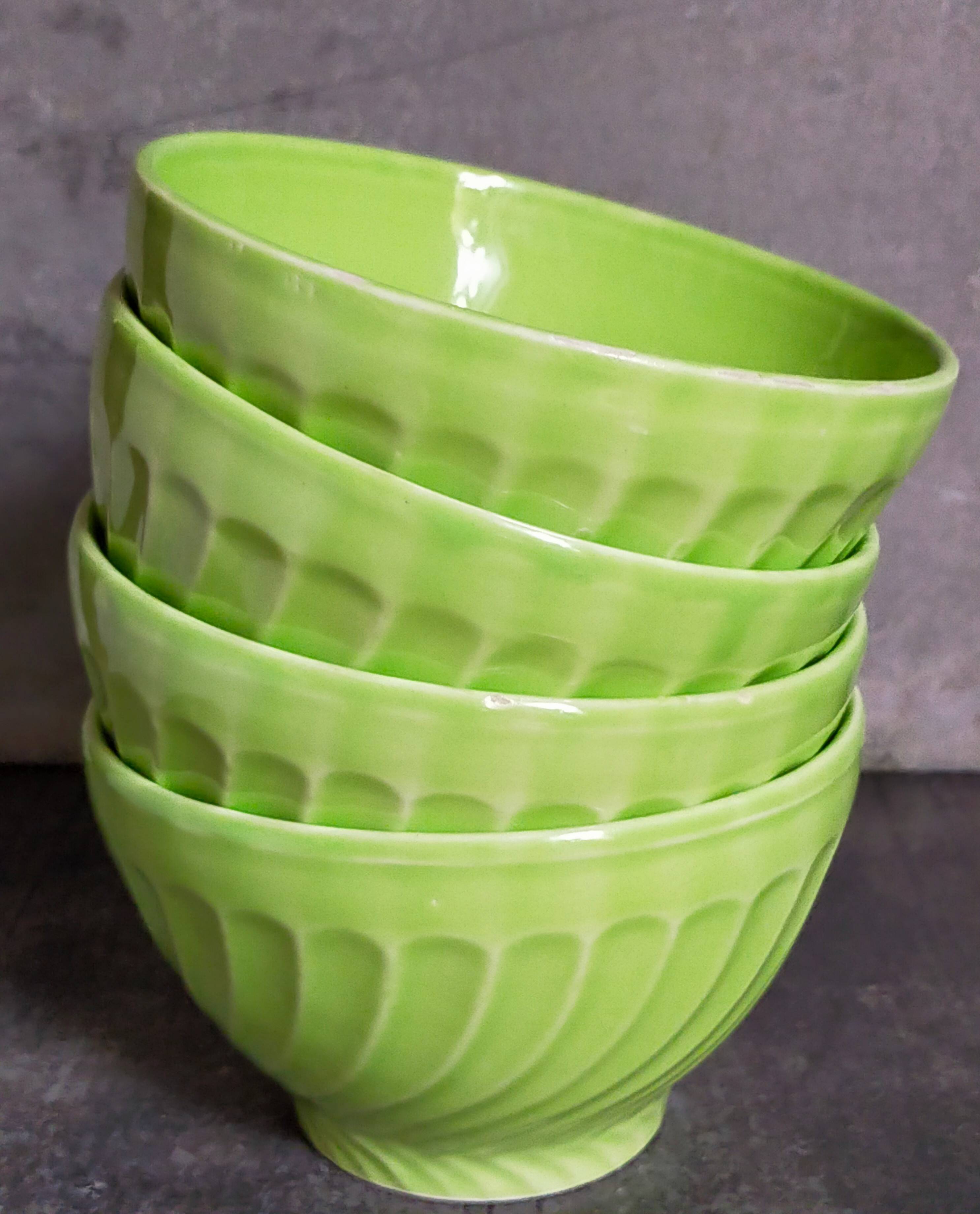Four vintage spring green earthenware bowls