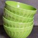 Four vintage spring green earthenware bowls