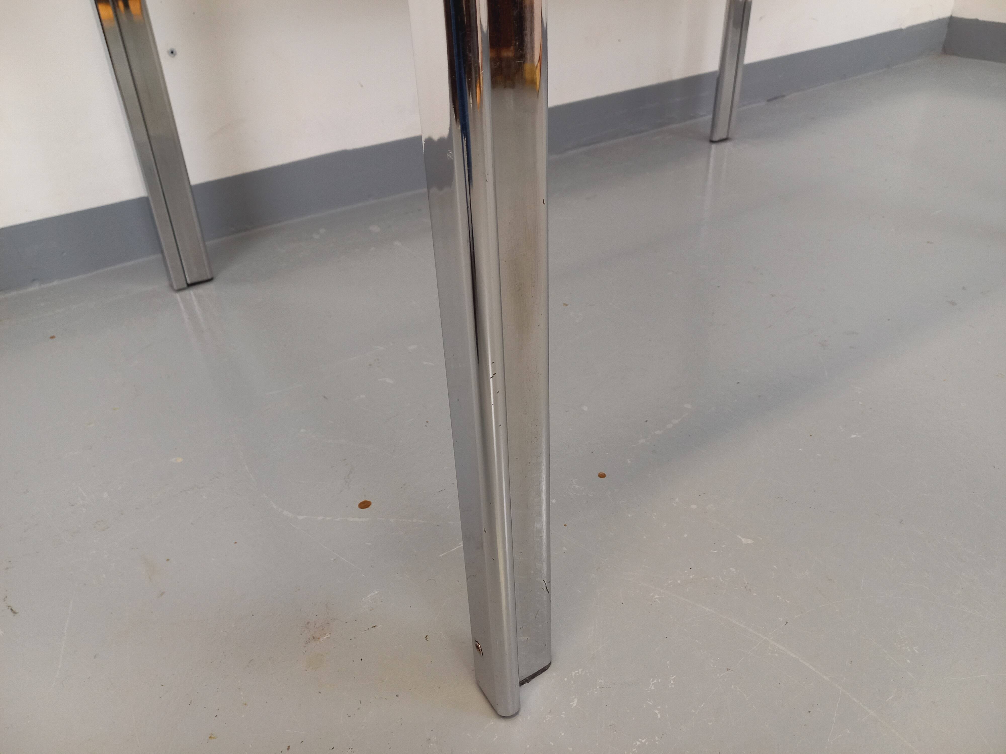 Vintage oval dining table in smoked glass and chrome metal, Space Age style.