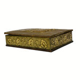 Old wooden box decorated with carved gold metal repelled vintage butterfly
