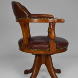 Swivel Chesterfield armchair in wood and leather
