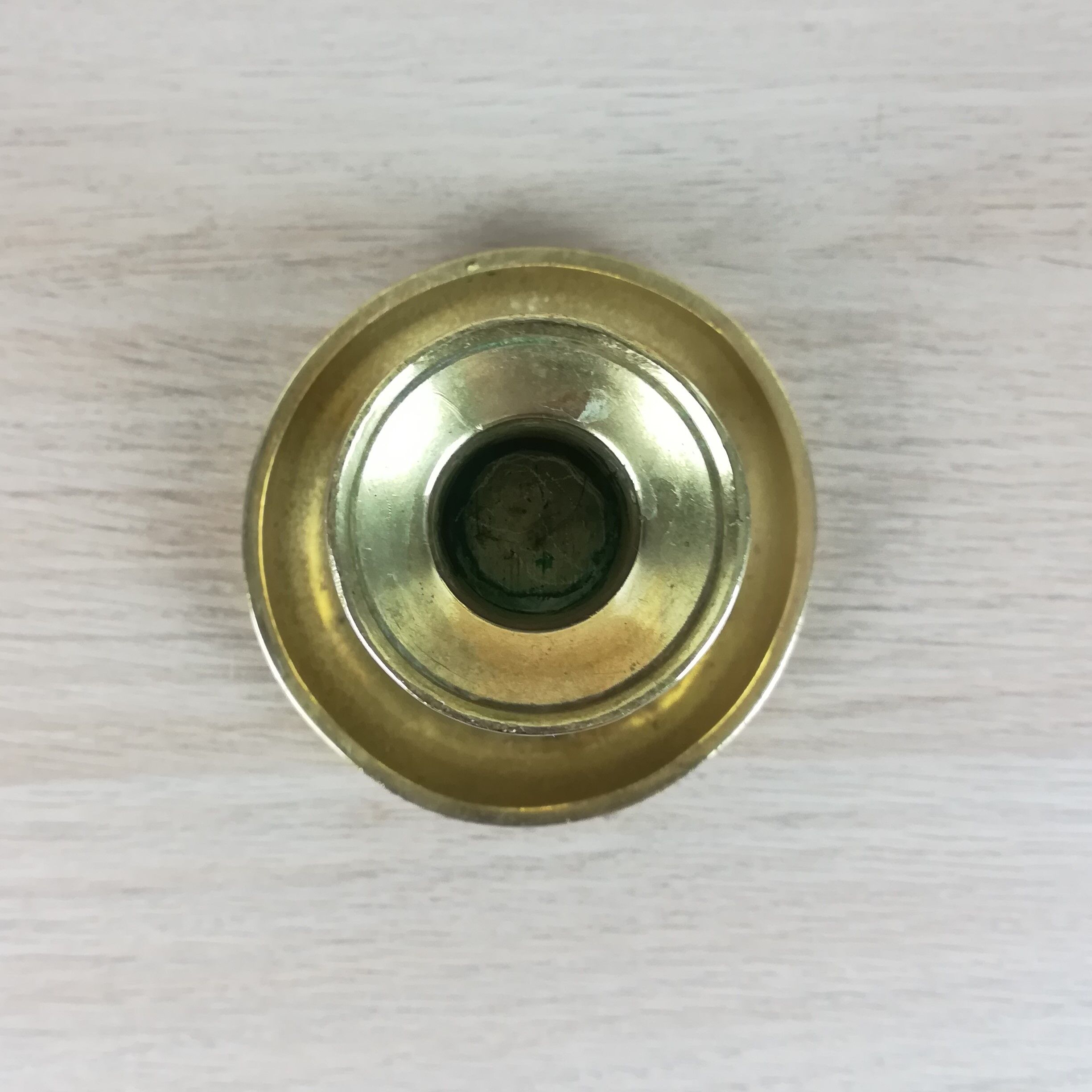 Brass pusher candle holder