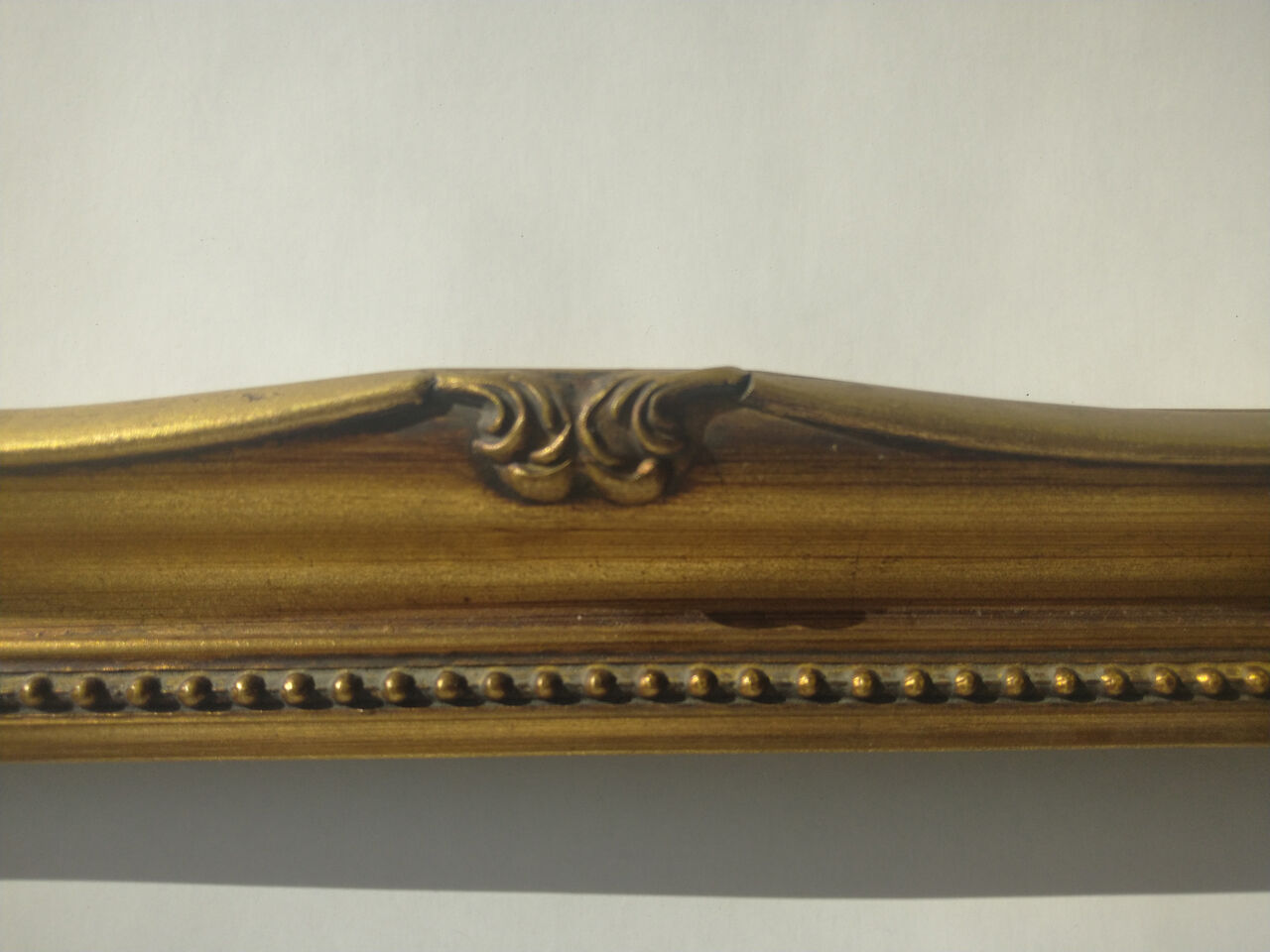 Golden sculpted frame for photo or artwork