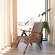 Vintage design armchair in mixed black fabric, walnut-coloured wood.