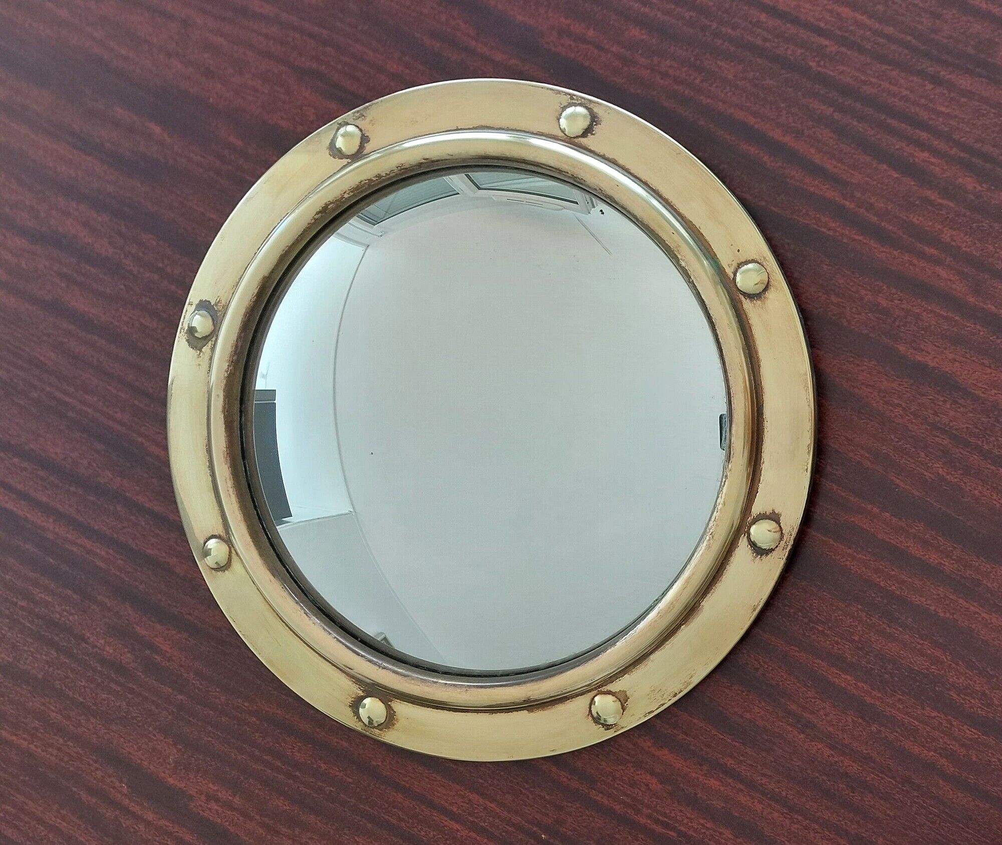 Witch porthole mirror 1940 in vintage gilded brass.