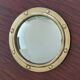 Witch porthole mirror 1940 in vintage gilded brass.