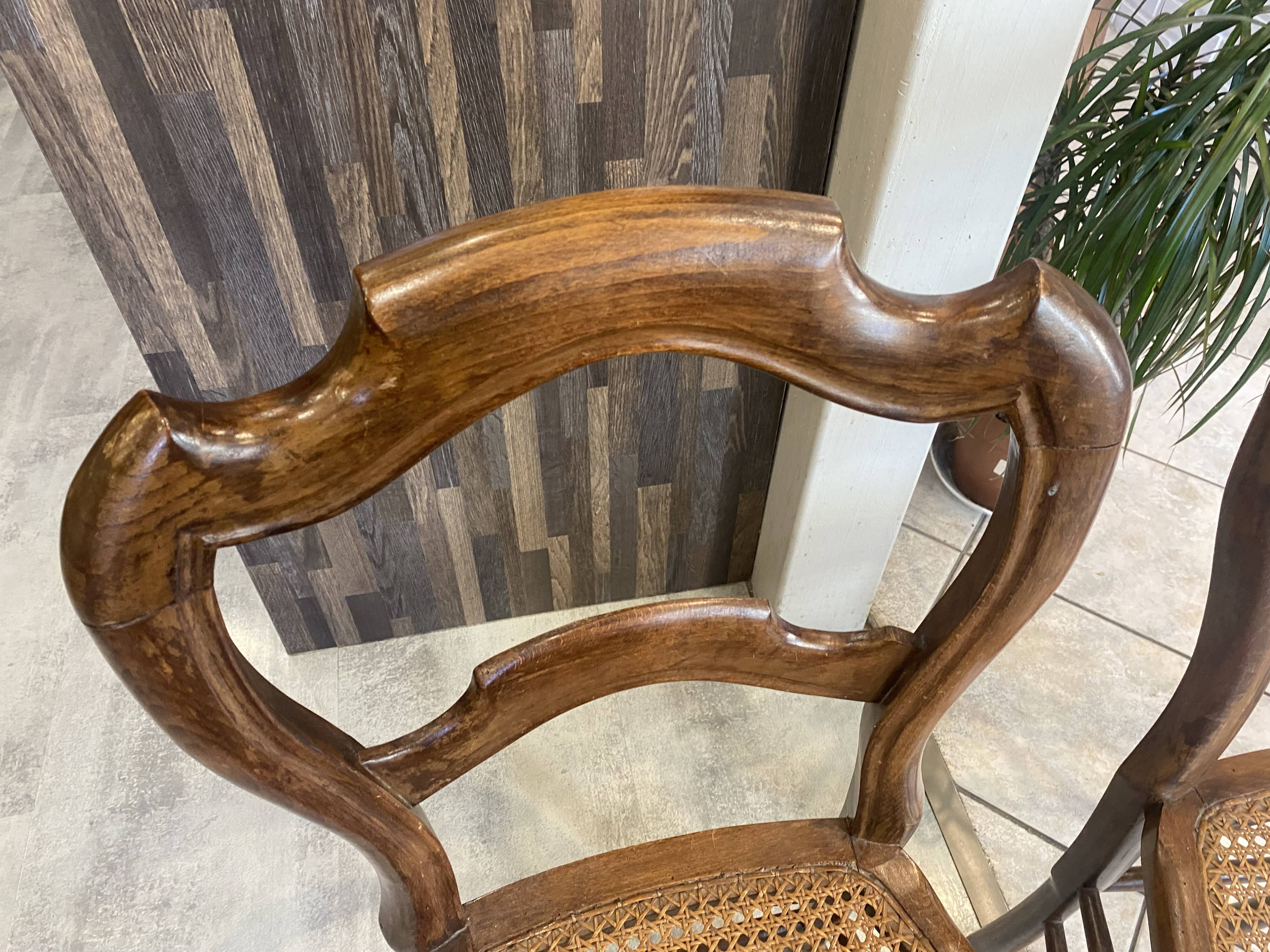 Pair of N2 antique caned and wooden chairs from the 1900s.