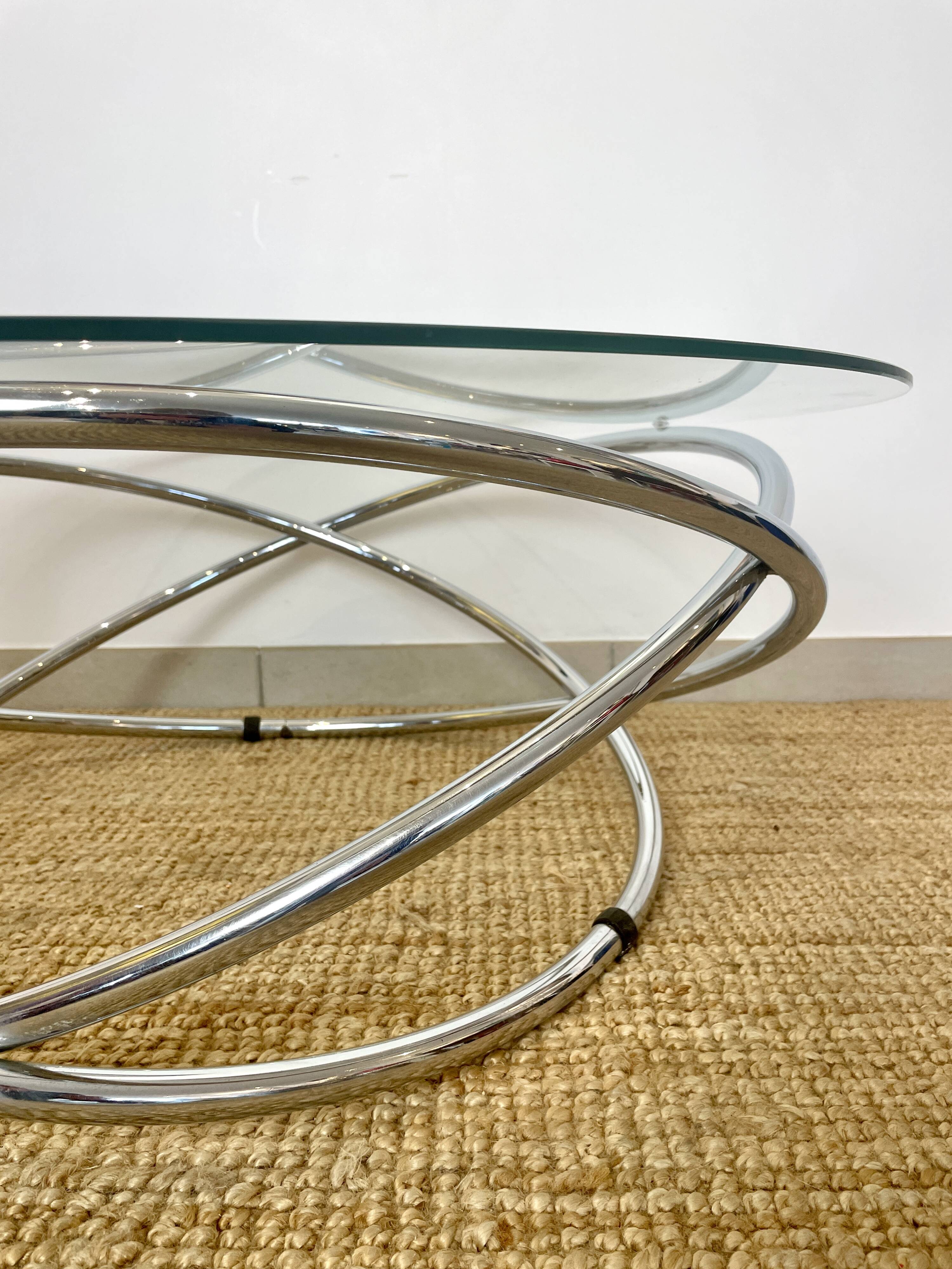 Coffee table with glass top and chrome tubular base