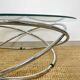 Coffee table with glass top and chrome tubular base