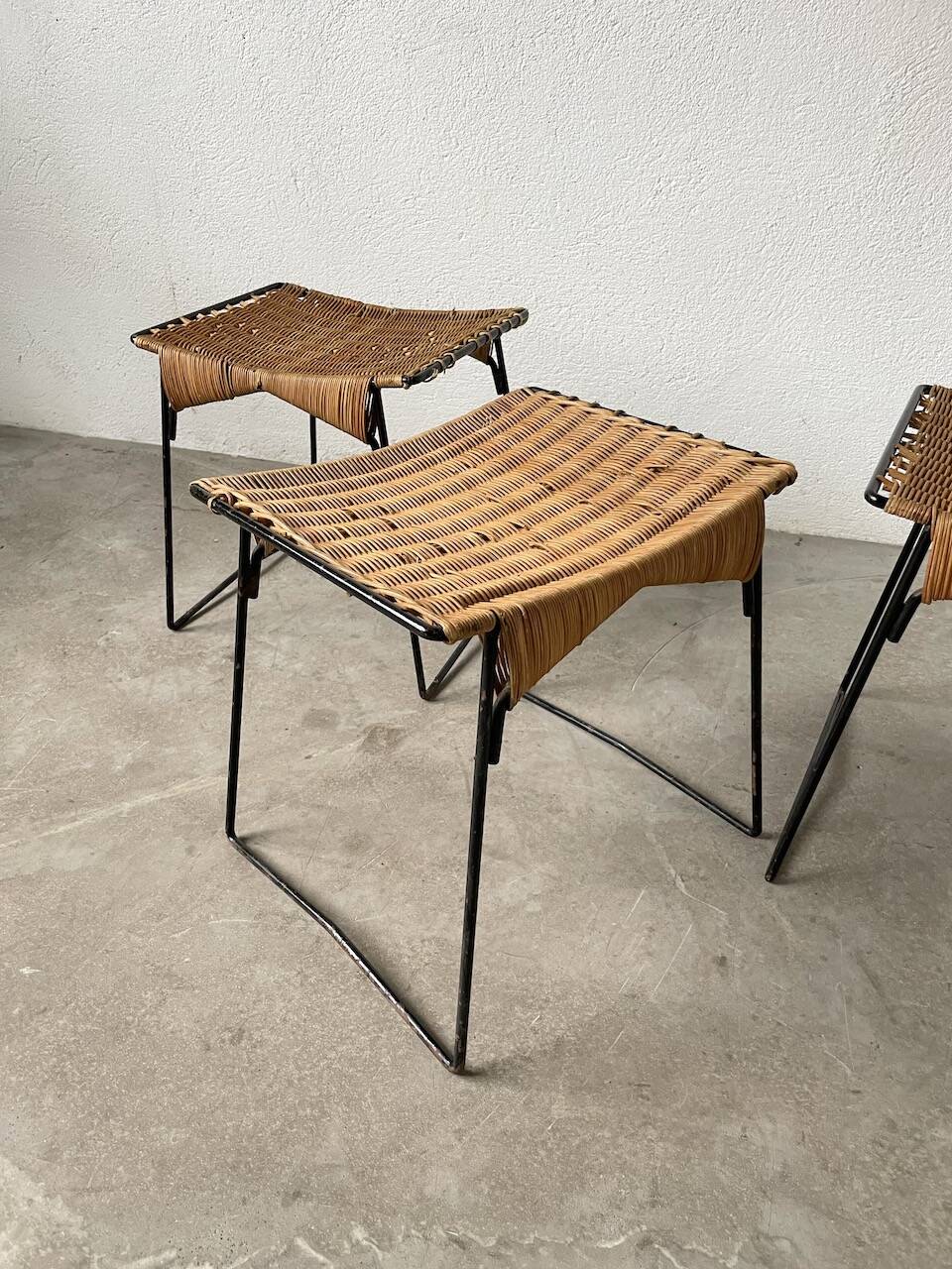 Set of three Raoul Guys wicker and metal stools