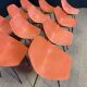 Set of 12 orange Guariche chairs