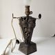 Antique lamp base in wrought iron with leaf motif in Art Deco style from the 1930s.