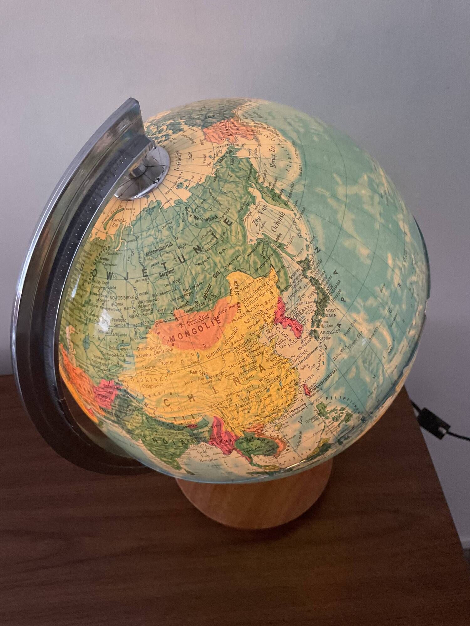 Bright vintage world map with wooden foot