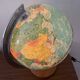 Bright vintage world map with wooden foot